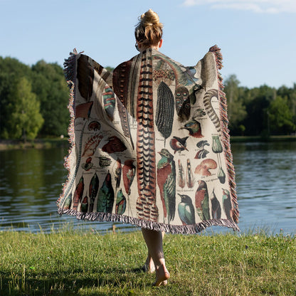Feathers Woven Blanket Held on a Woman's Back Outside