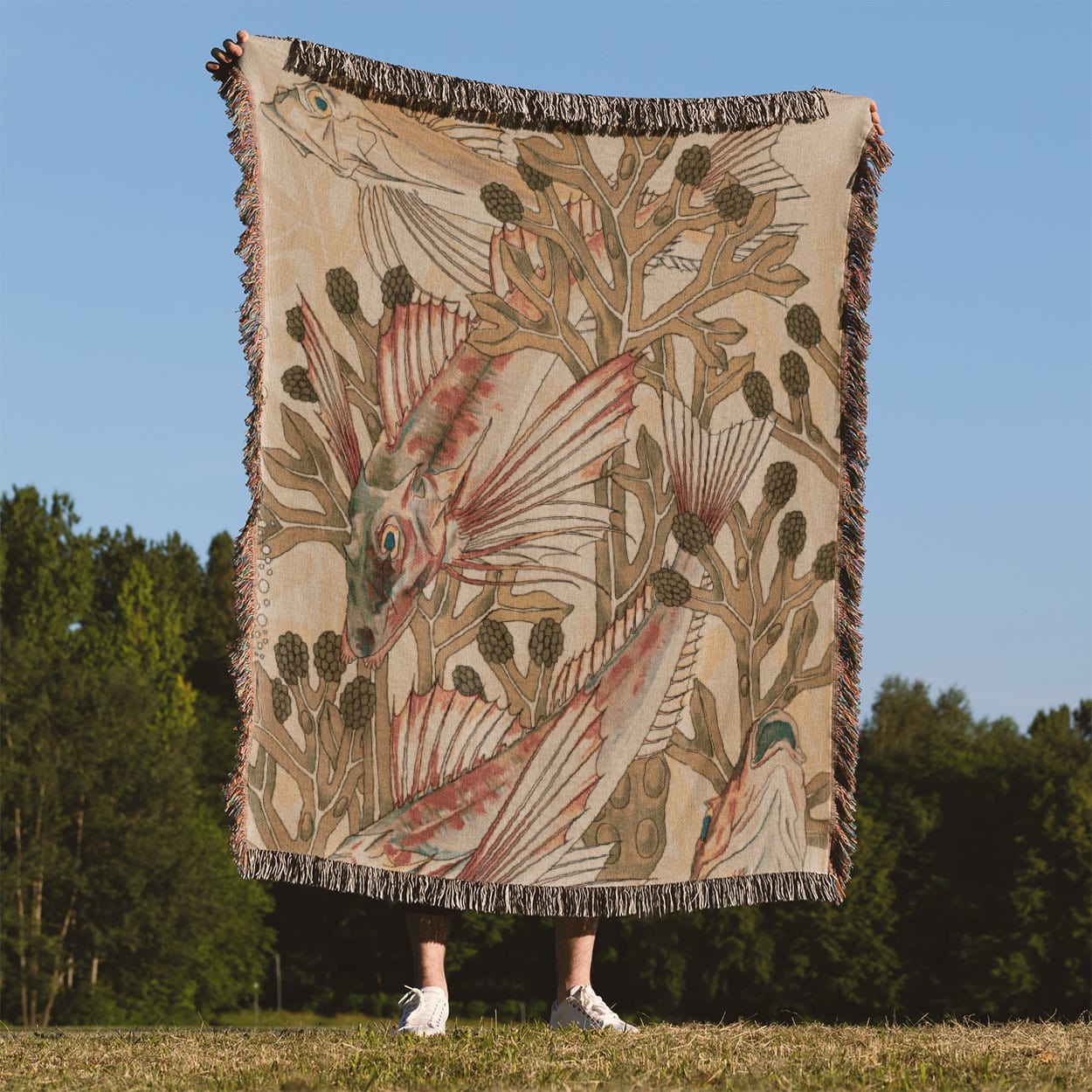 Fish in Seaweed Woven Blanket Held Up Outside