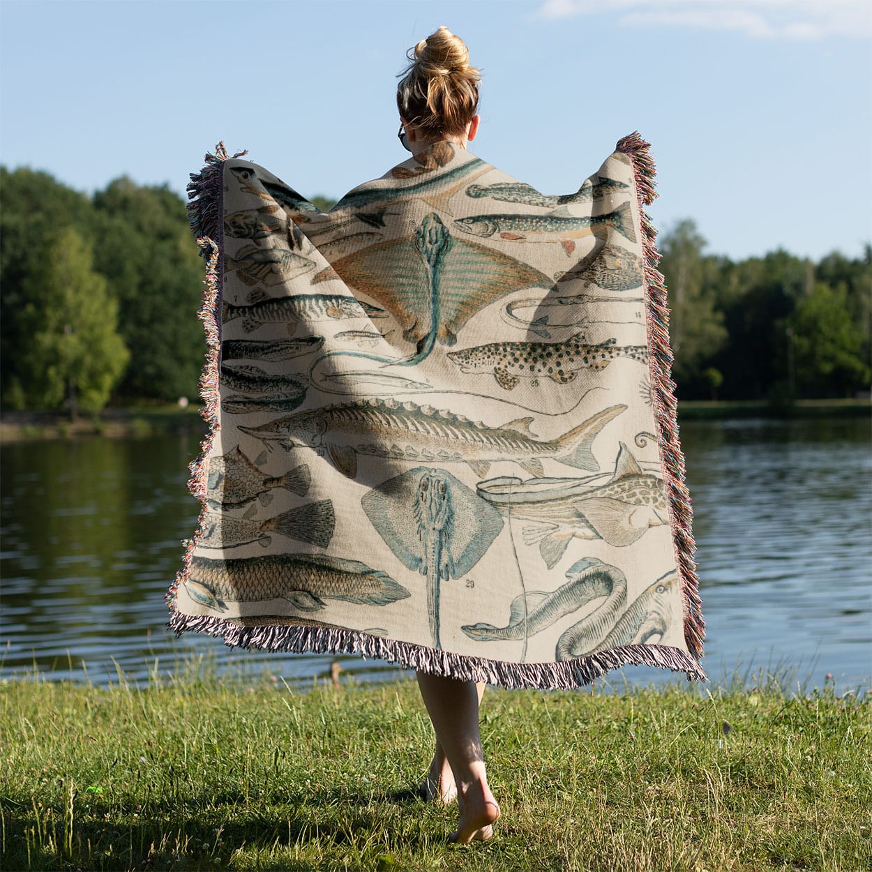 Fishing Woven Throw Blanket Held on a Woman's Back Outside