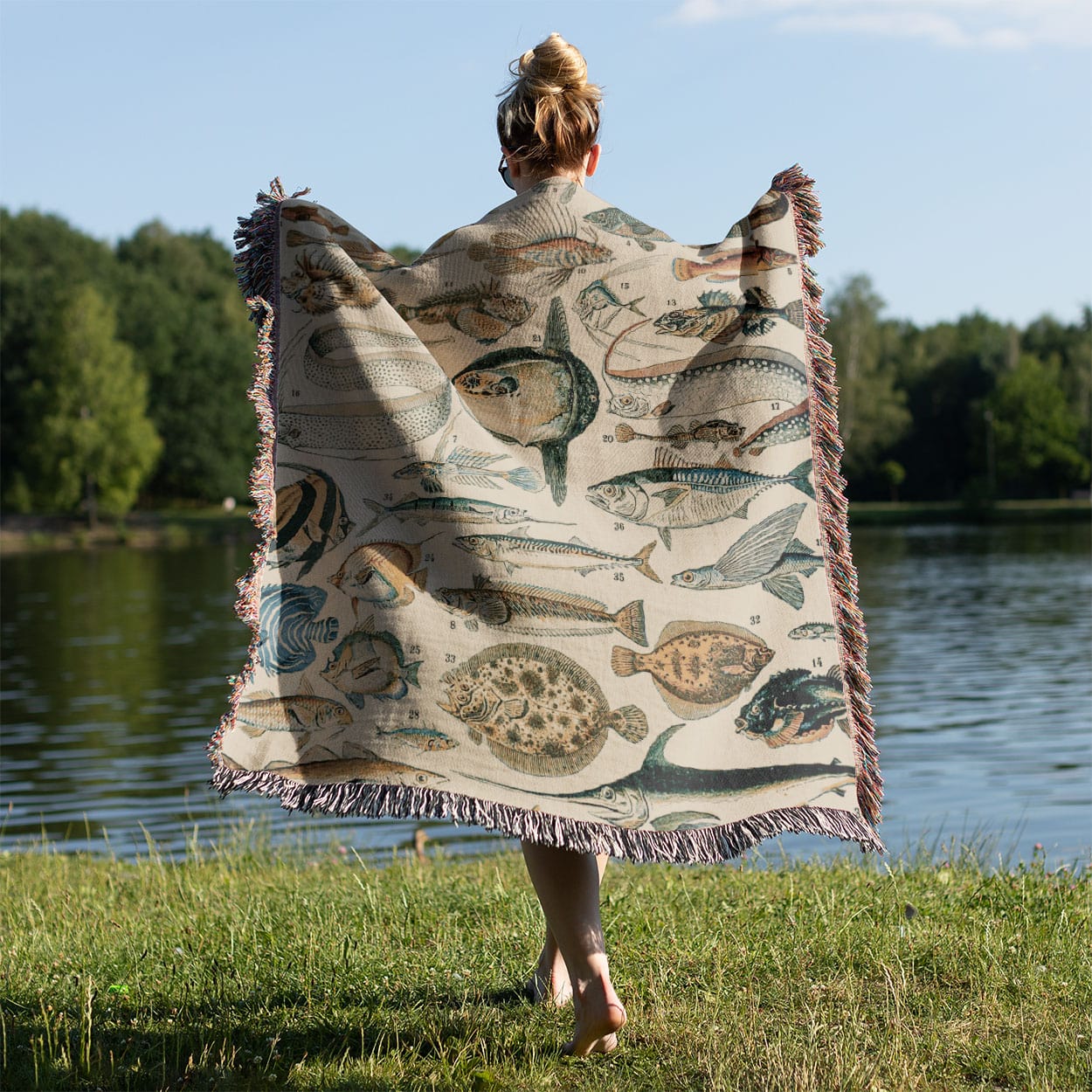 Fishing Woven Throw Blanket Held on a Woman's Back Outside