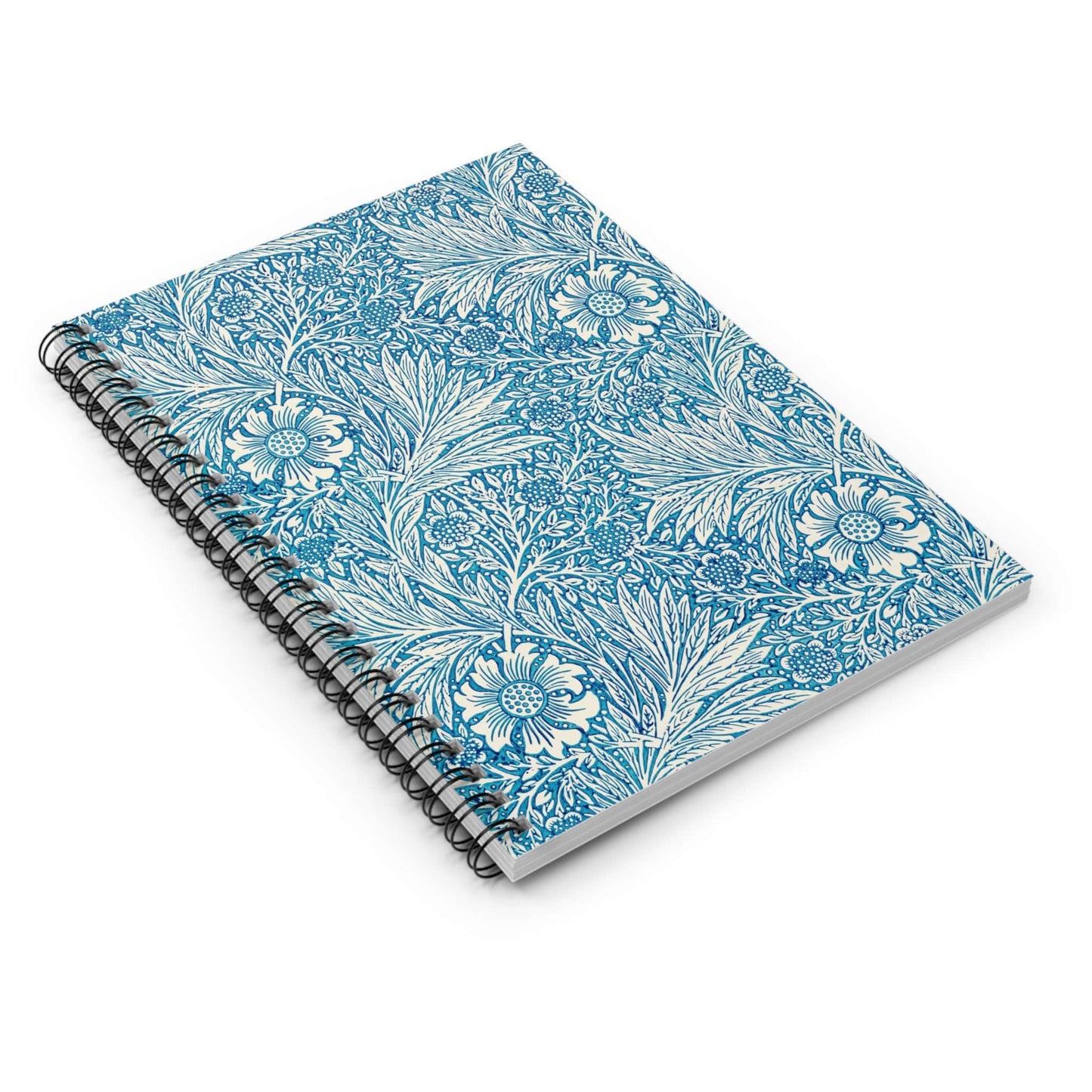 Floral Pattern Spiral Notebook Laying Flat on White Surface