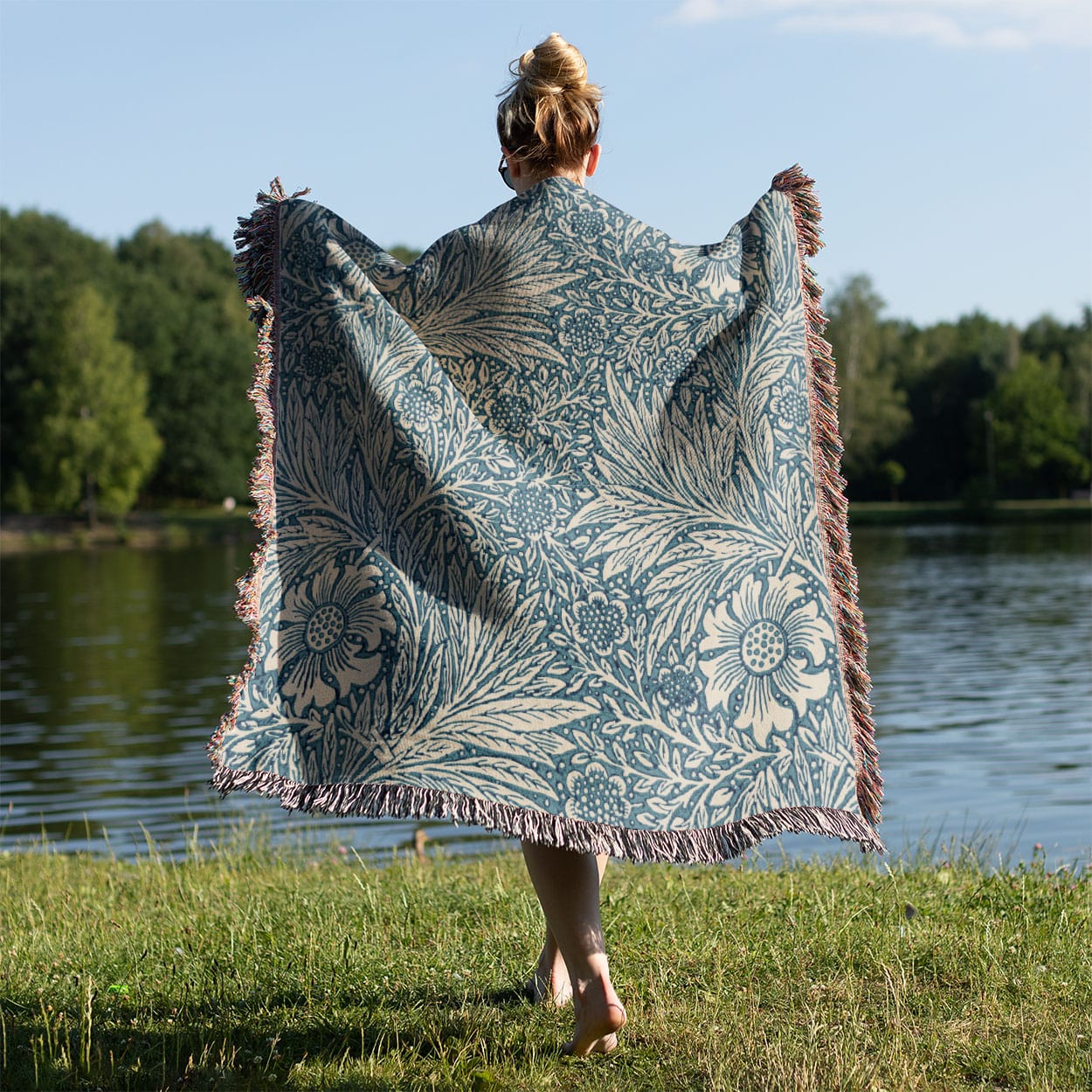 Floral Pattern Woven Blanket Held on a Woman's Back Outside
