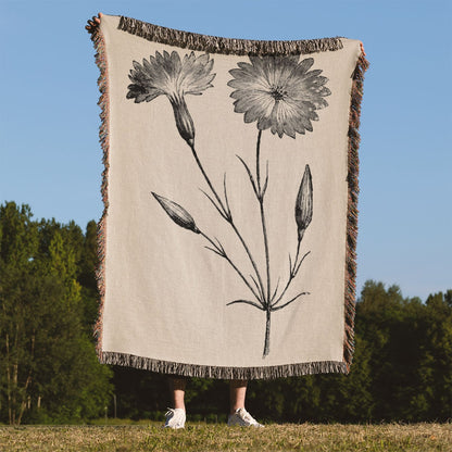Floral Woven Blanket Held Up Outside