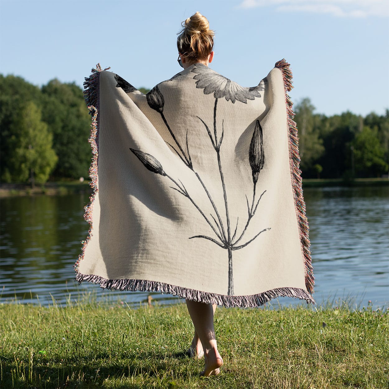 Floral Woven Blanket Held on a Woman's Back Outside