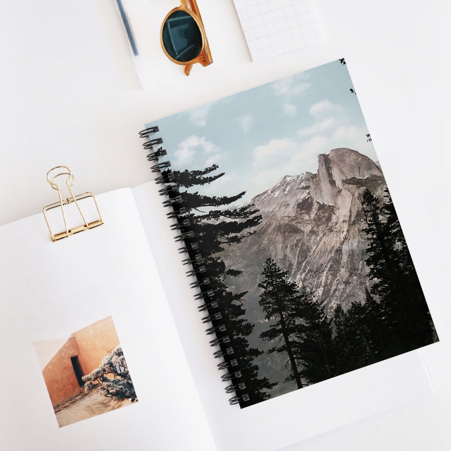 Forest and Mountains Spiral Notebook Displayed on Desk