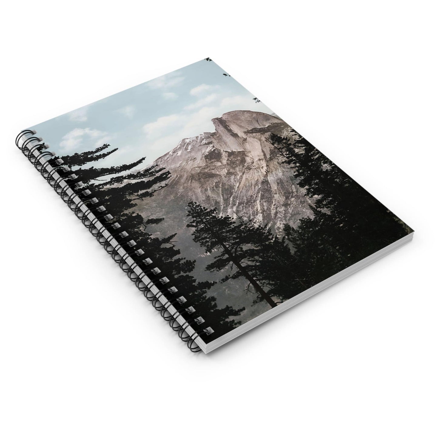 Forest and Mountains Spiral Notebook Laying Flat on White Surface