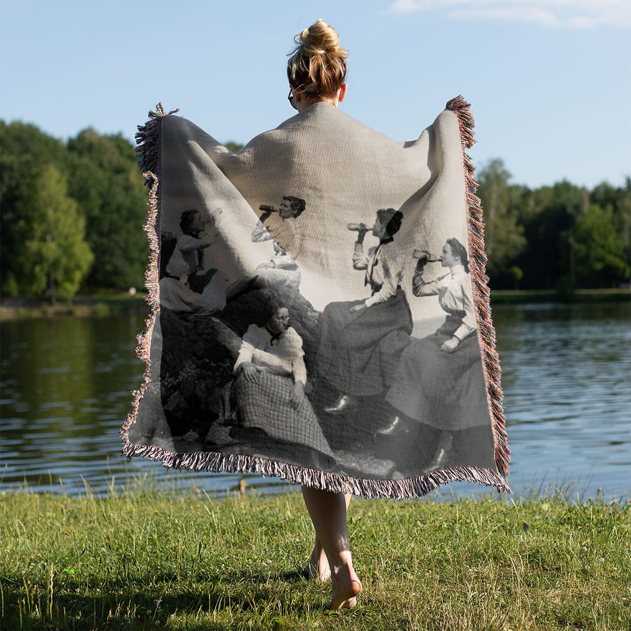 Fun College Woven Blanket Held on a Woman's Back Outside