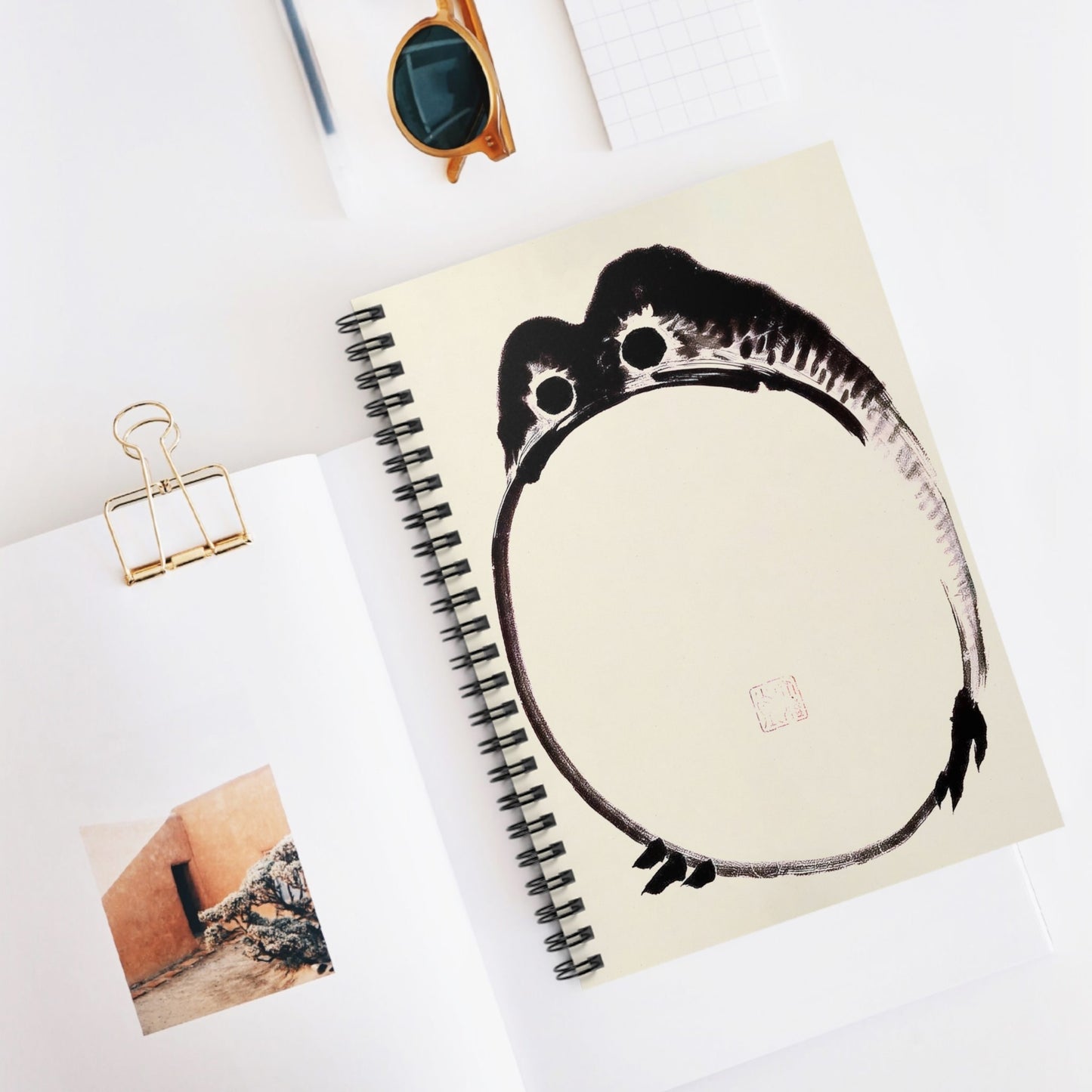 Funny Japanese Toad Spiral Notebook Displayed on Desk