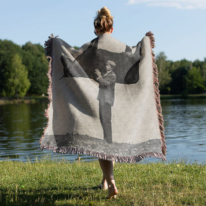 Funny Woven Blanket Held on a Woman's Back Outside