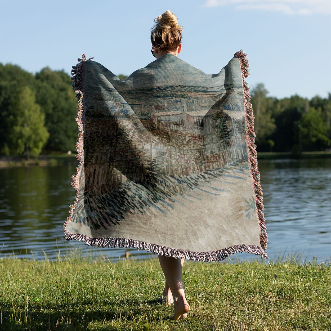 Garden Landscape Woven Throw Blanket Held on a Woman's Back Outside