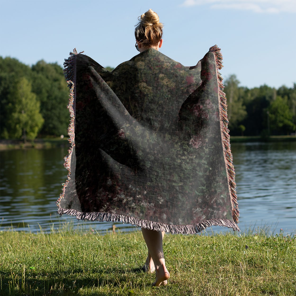 Gardening Woven Throw Blanket Held on a Woman's Back Outside