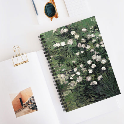Green with White Flowers Spiral Notebook Displayed on Desk