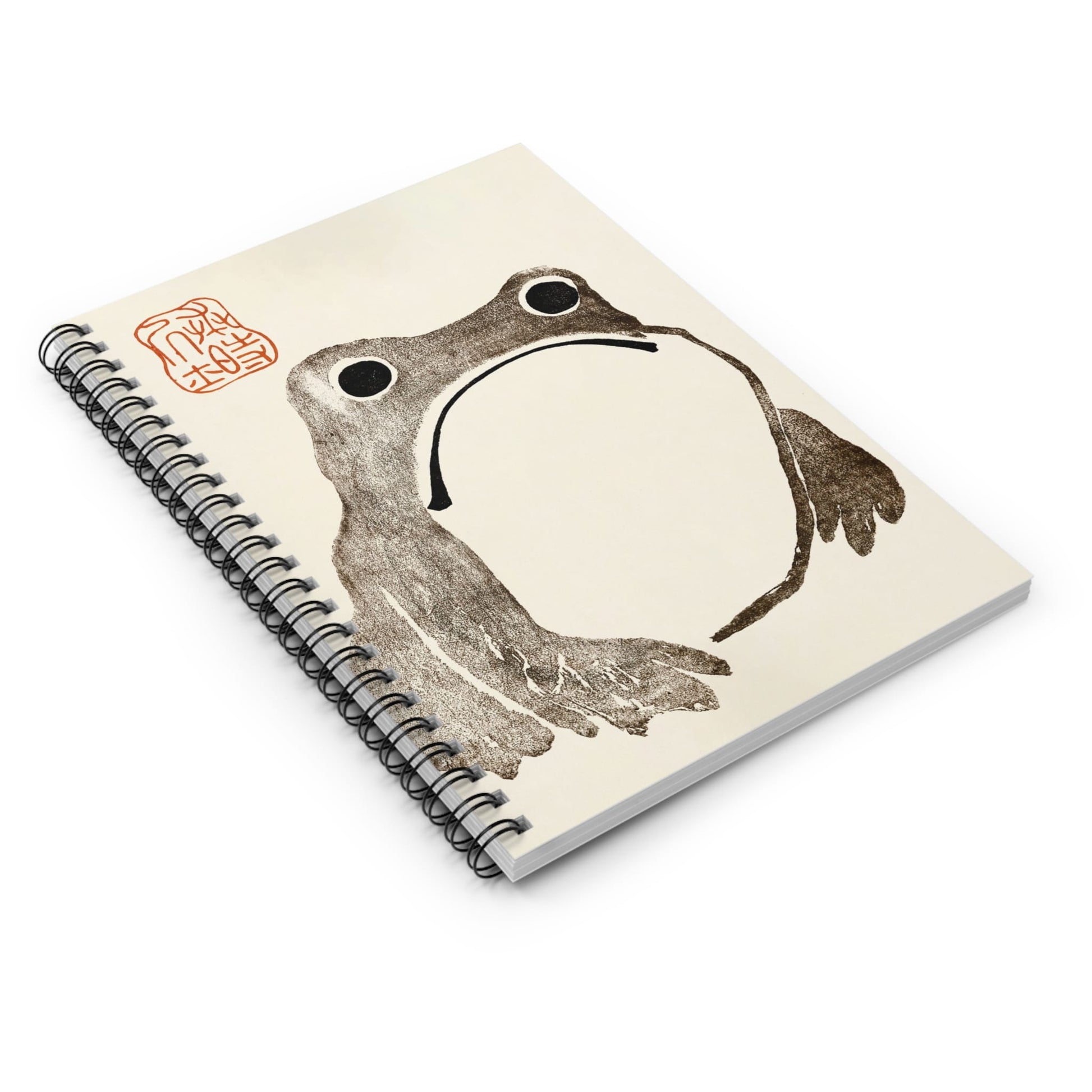 Grumpy Frog Spiral Notebook Laying Flat on White Surface