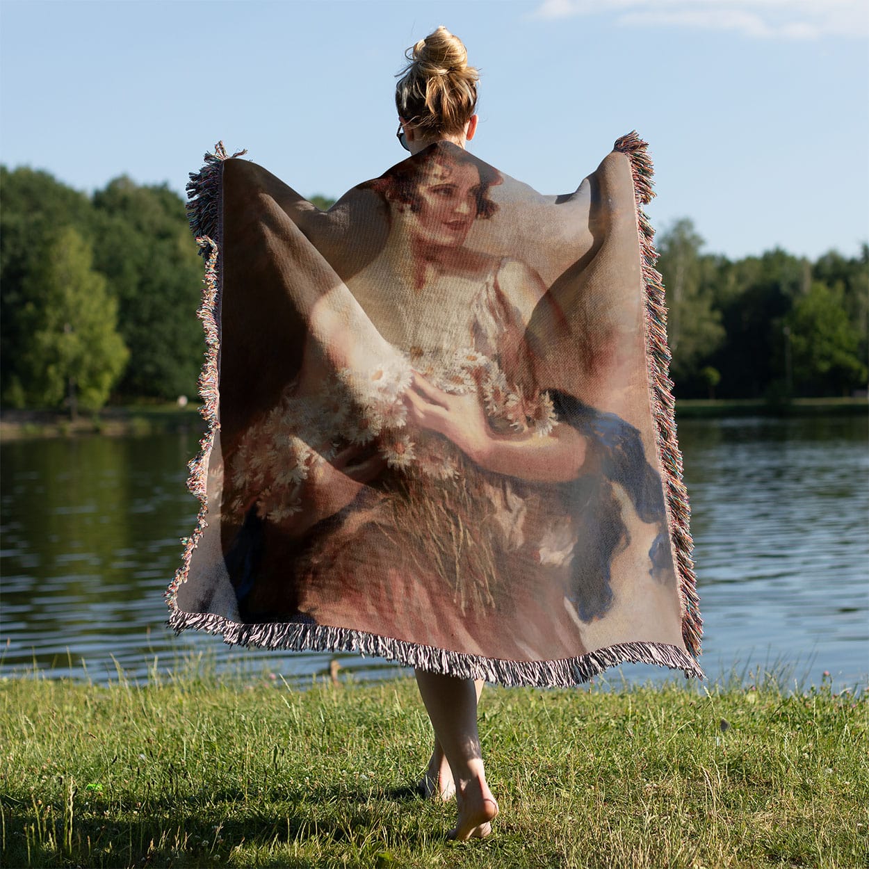 Hands Full of Flowers Woven Blanket Held on a Woman's Back Outside