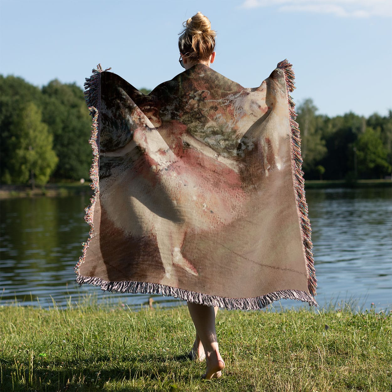 Impressionist Ballerina Woven Blanket Held on a Woman's Back Outside