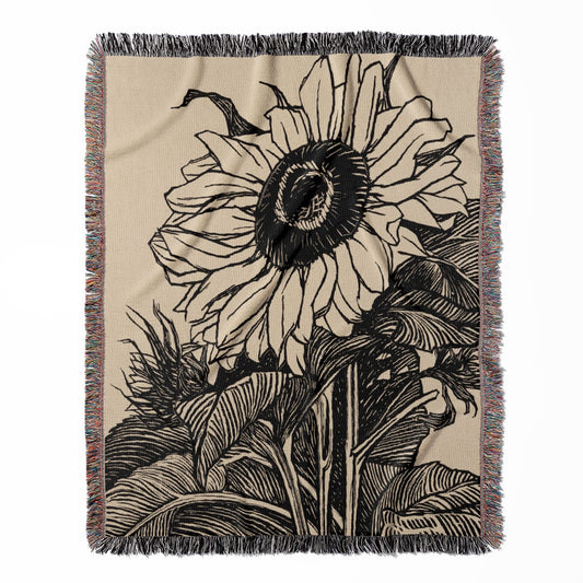 Sunflower woven throw blanket, crafted from 100% cotton, offering a soft and cozy texture with an ink drawing design for home decor.