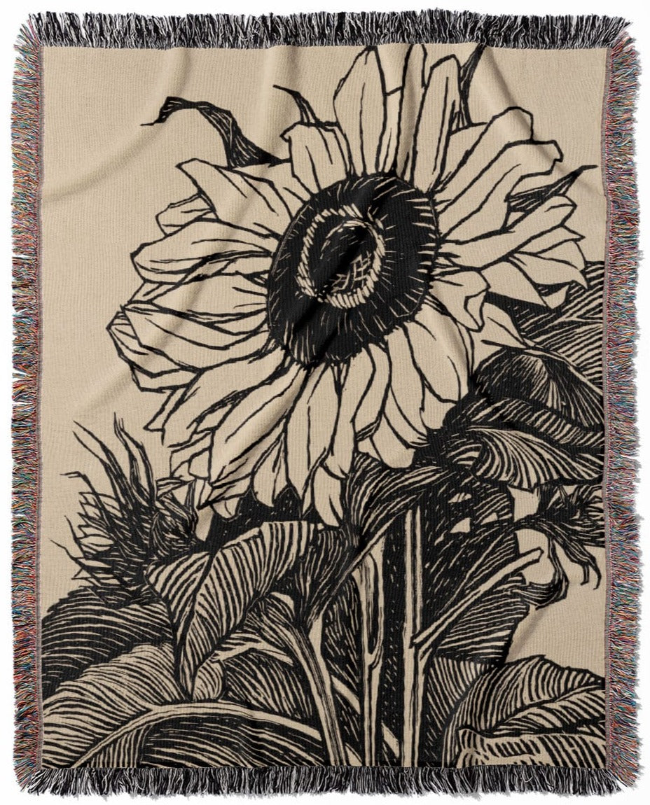 Sunflower woven throw blanket, crafted from 100% cotton, offering a soft and cozy texture with an ink drawing design for home decor.