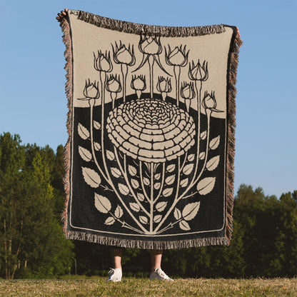 Ink Flower Aesthetic Woven Blanket Held Up Outside