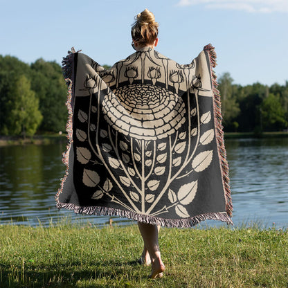 Ink Flower Aesthetic Woven Blanket Held on a Woman's Back Outside