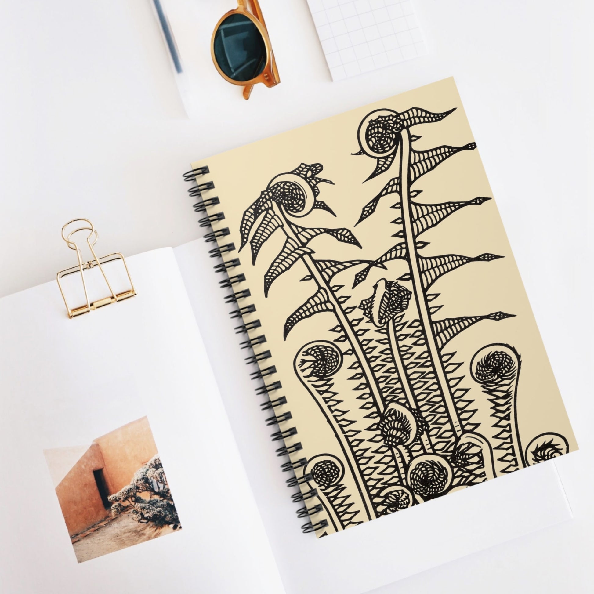 Ink Plants Spiral Notebook Displayed on Desk