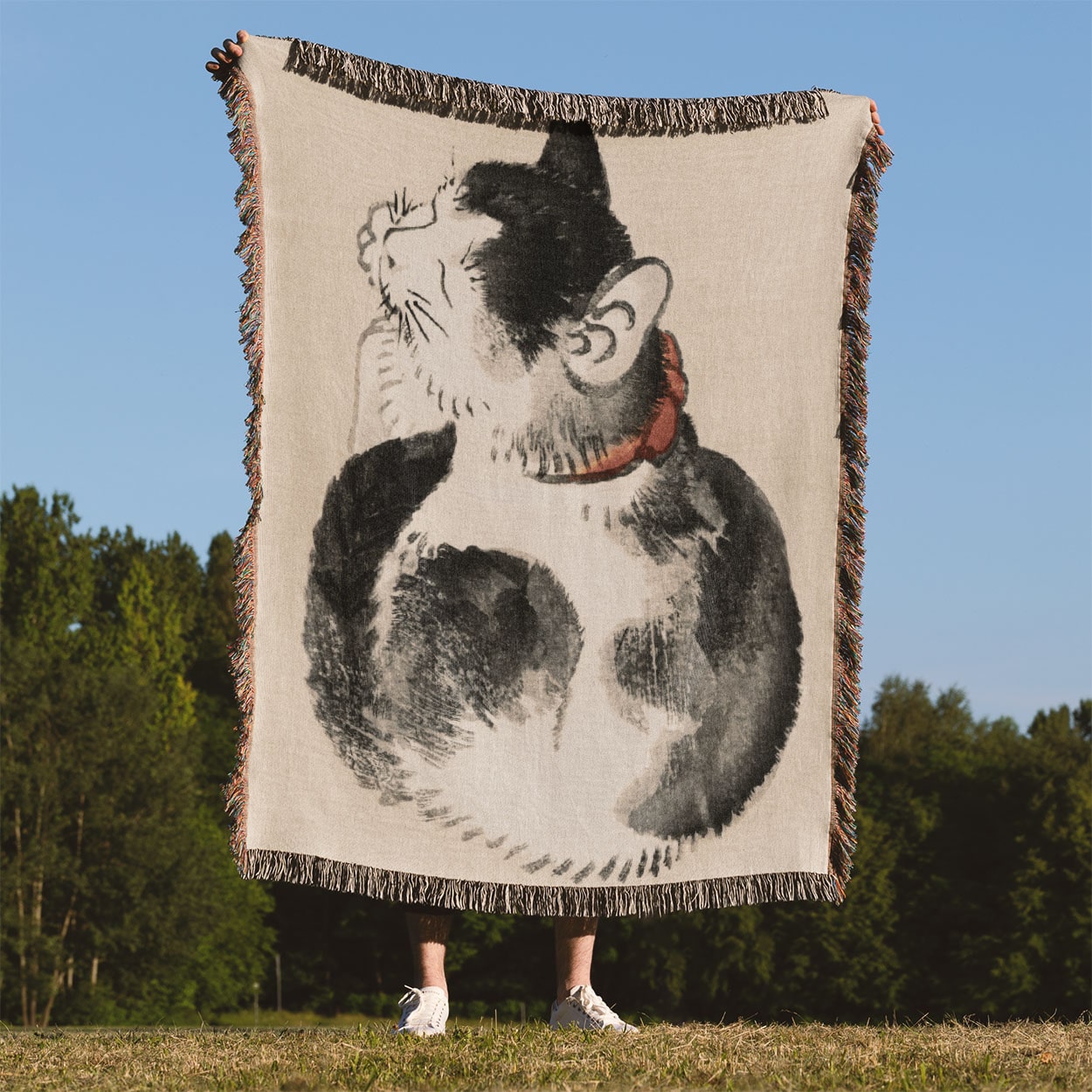 Japanese Black and White Cat Woven Blanket Held Up Outside
