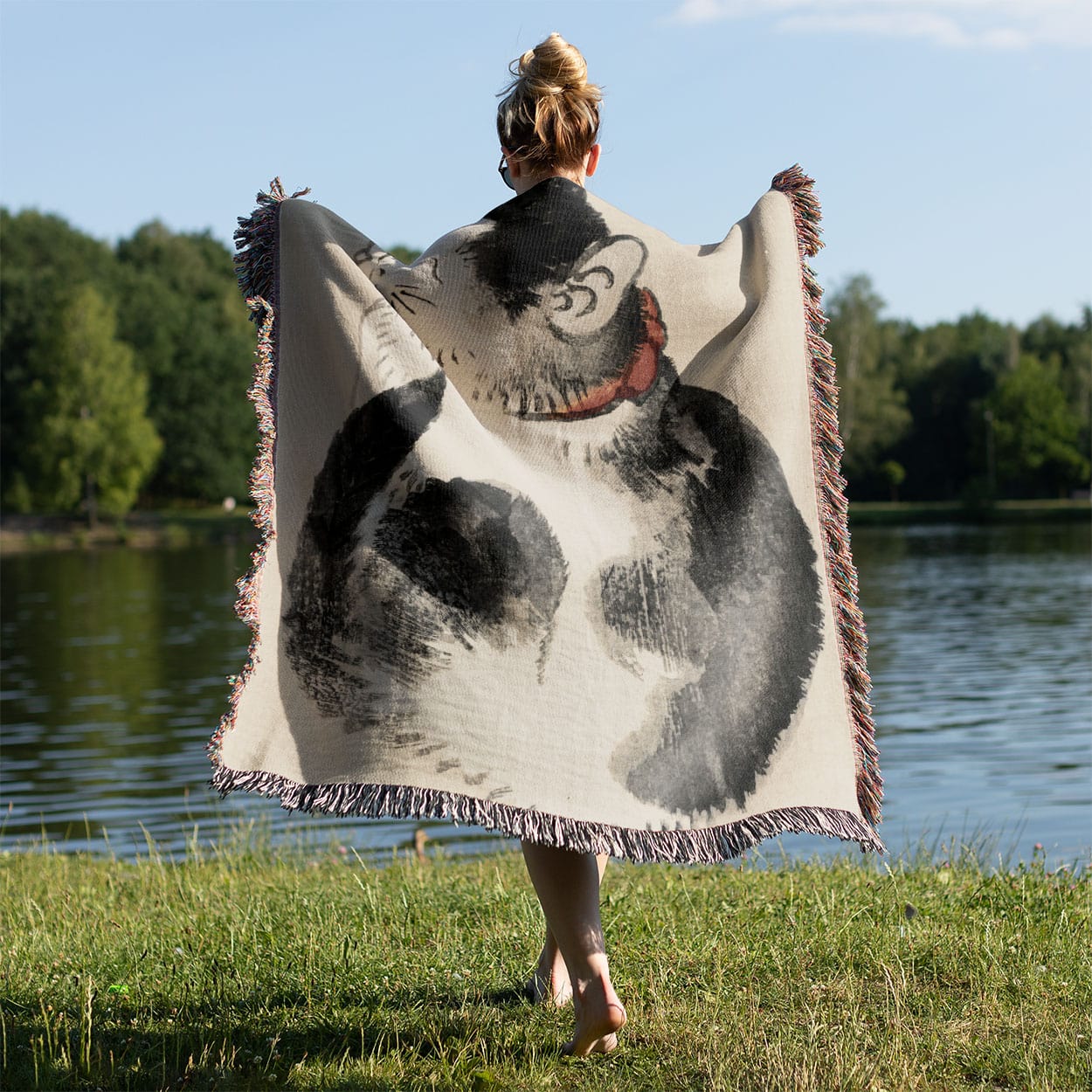 Japanese Black and White Cat Woven Blanket Held on a Woman's Back Outside