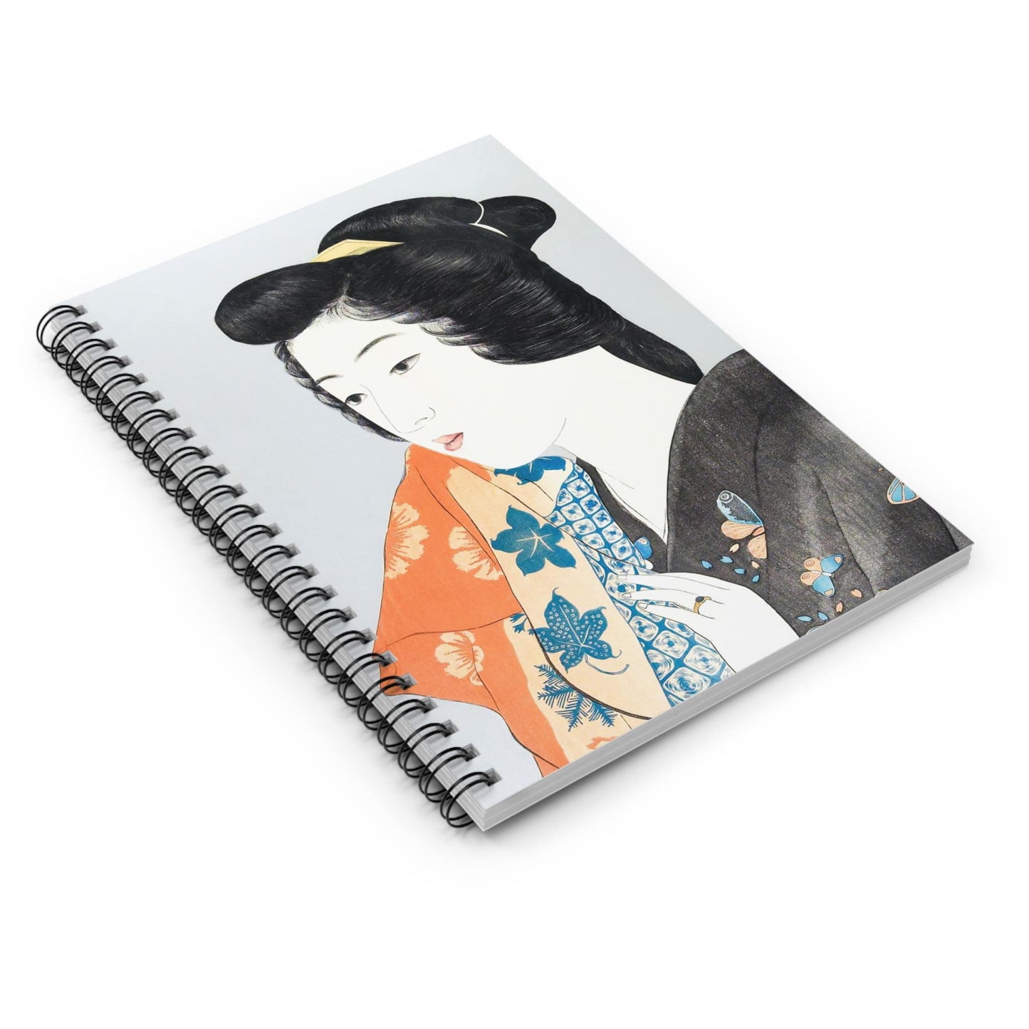 Japanese Fashion Spiral Notebook Laying Flat on White Surface