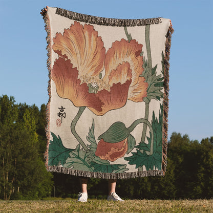 Japanese Orange Flower Woven Throw Blanket Held Up Outside