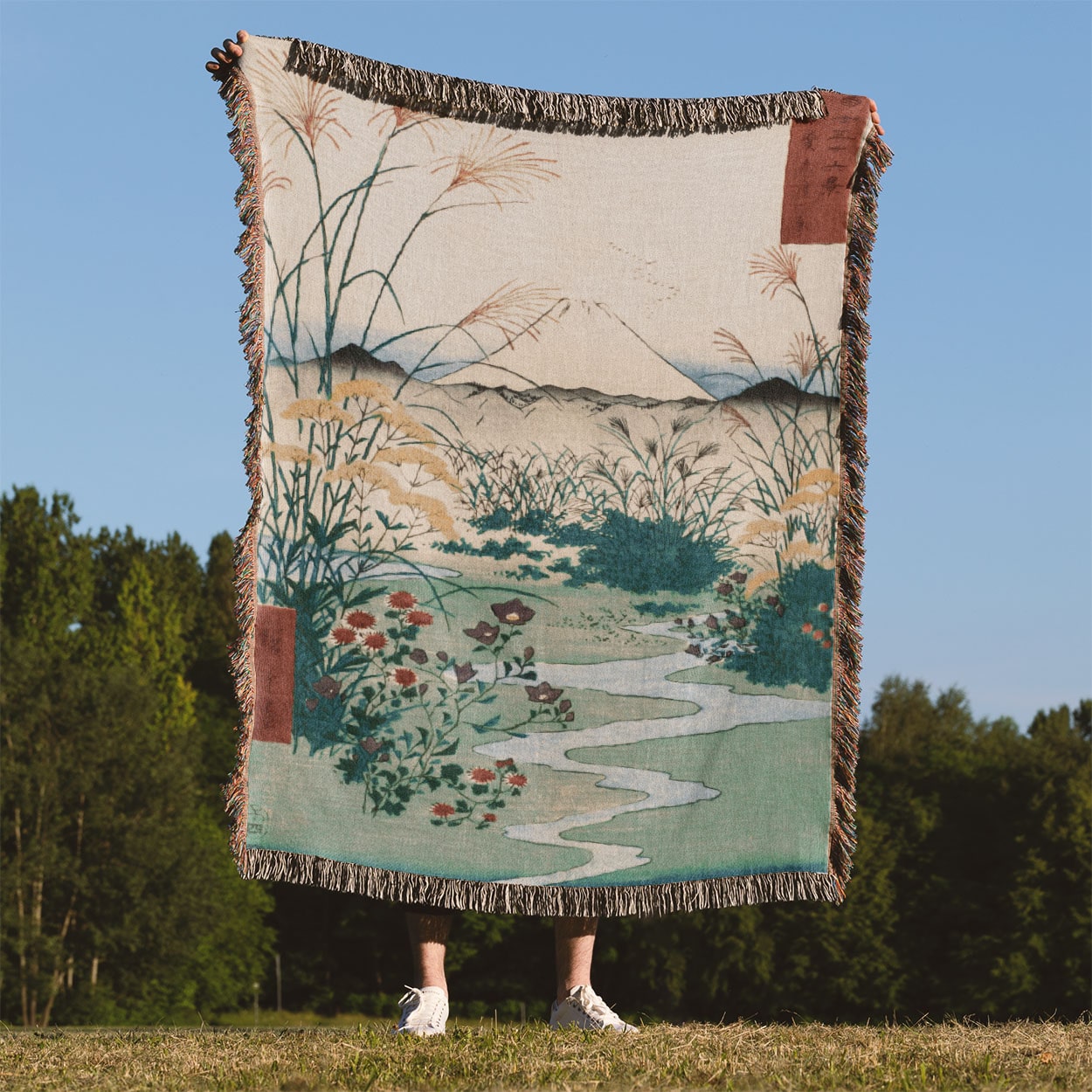 Japanese Spring Landscape Woven Blanket Held Up Outside