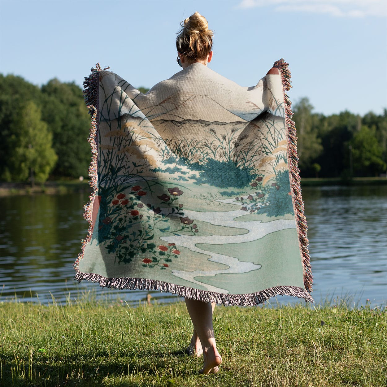Japanese Spring Landscape Woven Blanket Held on a Woman's Back Outside