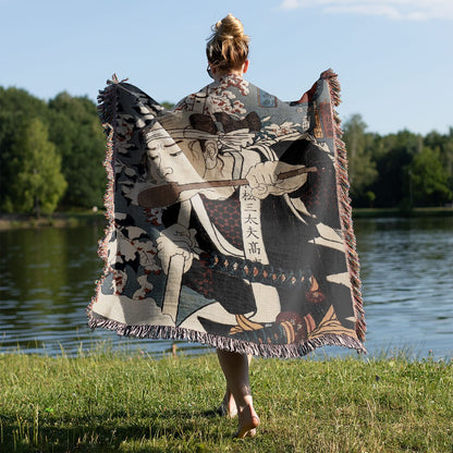 Japanese Warrior Woven Blanket Held on a Woman's Back Outside