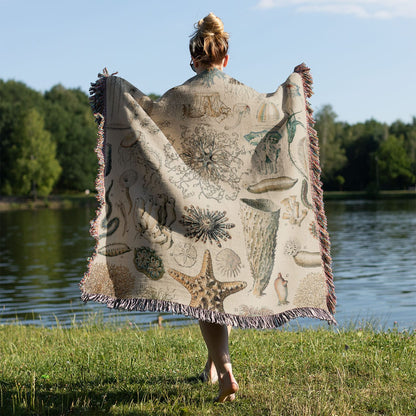 Jelly Fish Woven Blanket Held on a Woman's Back Outside
