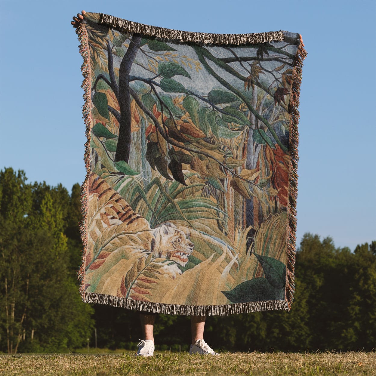 Jungle Landscape Woven Throw Blanket Held Up Outside