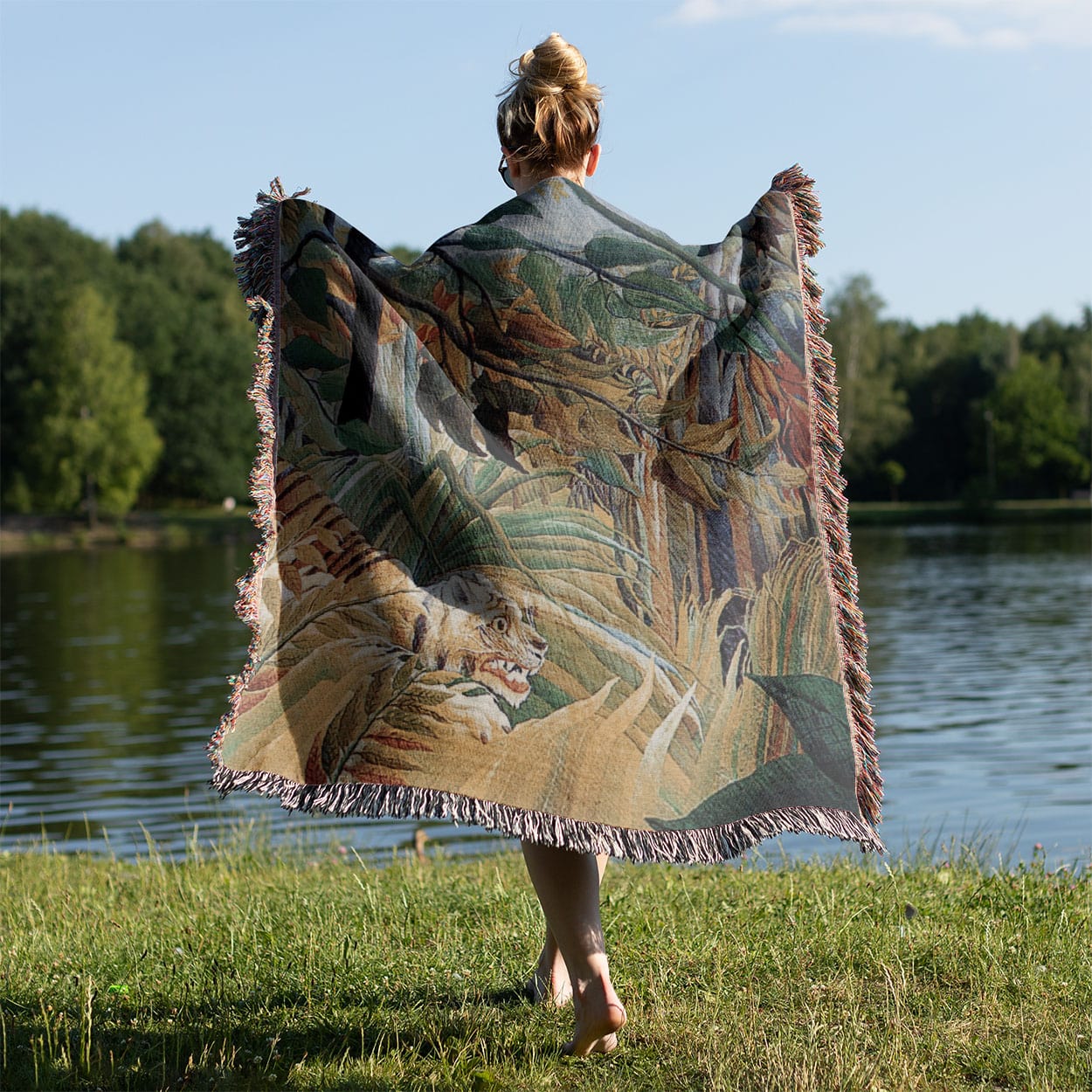 Jungle Landscape Woven Blanket Held on a Woman's Back Outside