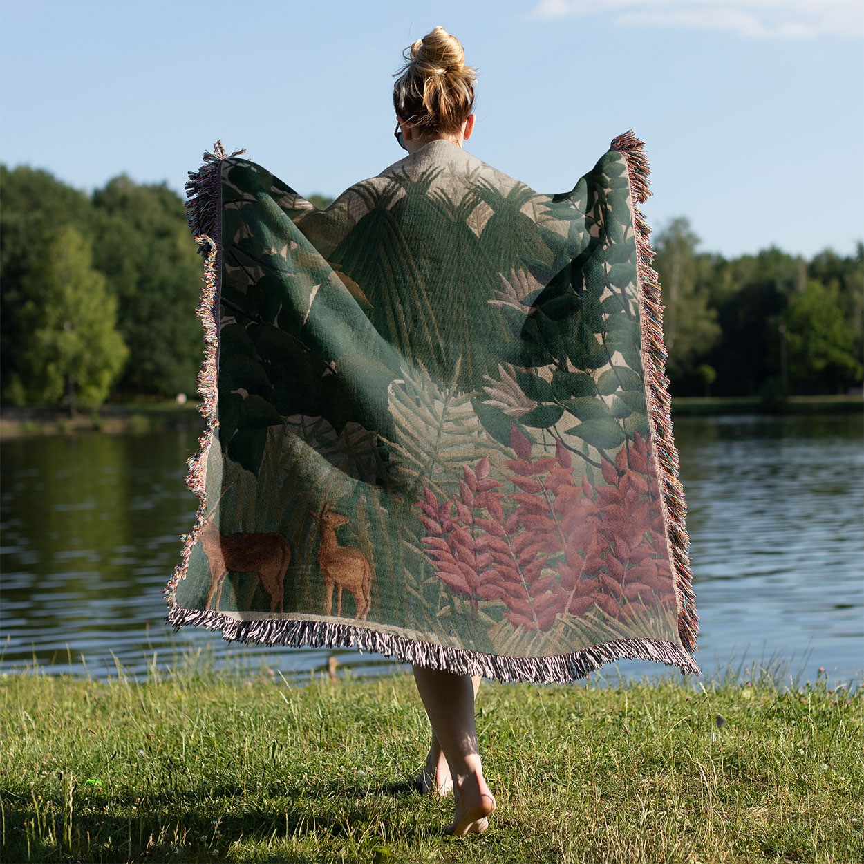 Jungle Woven Throw Blanket Held on a Woman's Back Outside