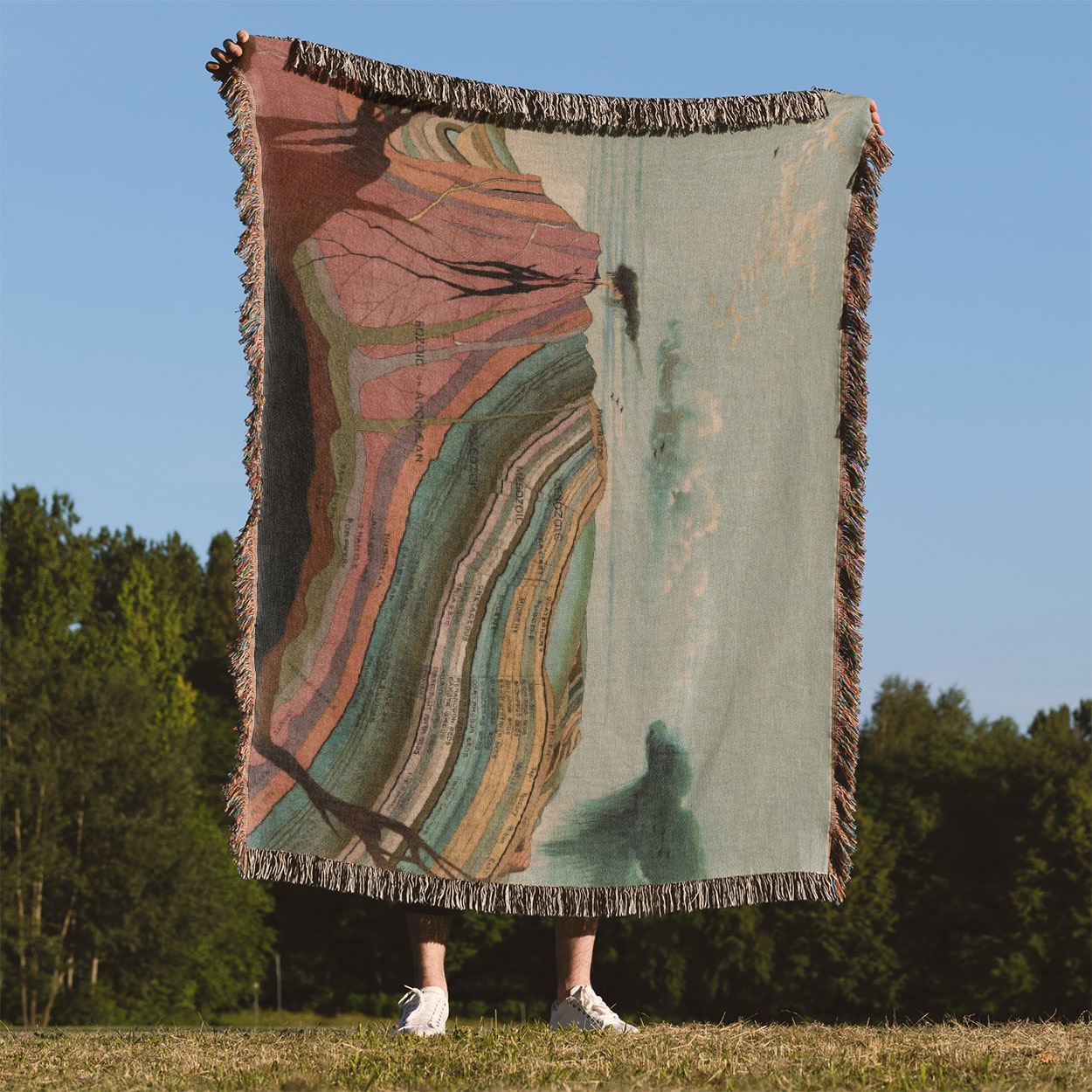 Layers of the Earth Woven Blanket Held Up Outside