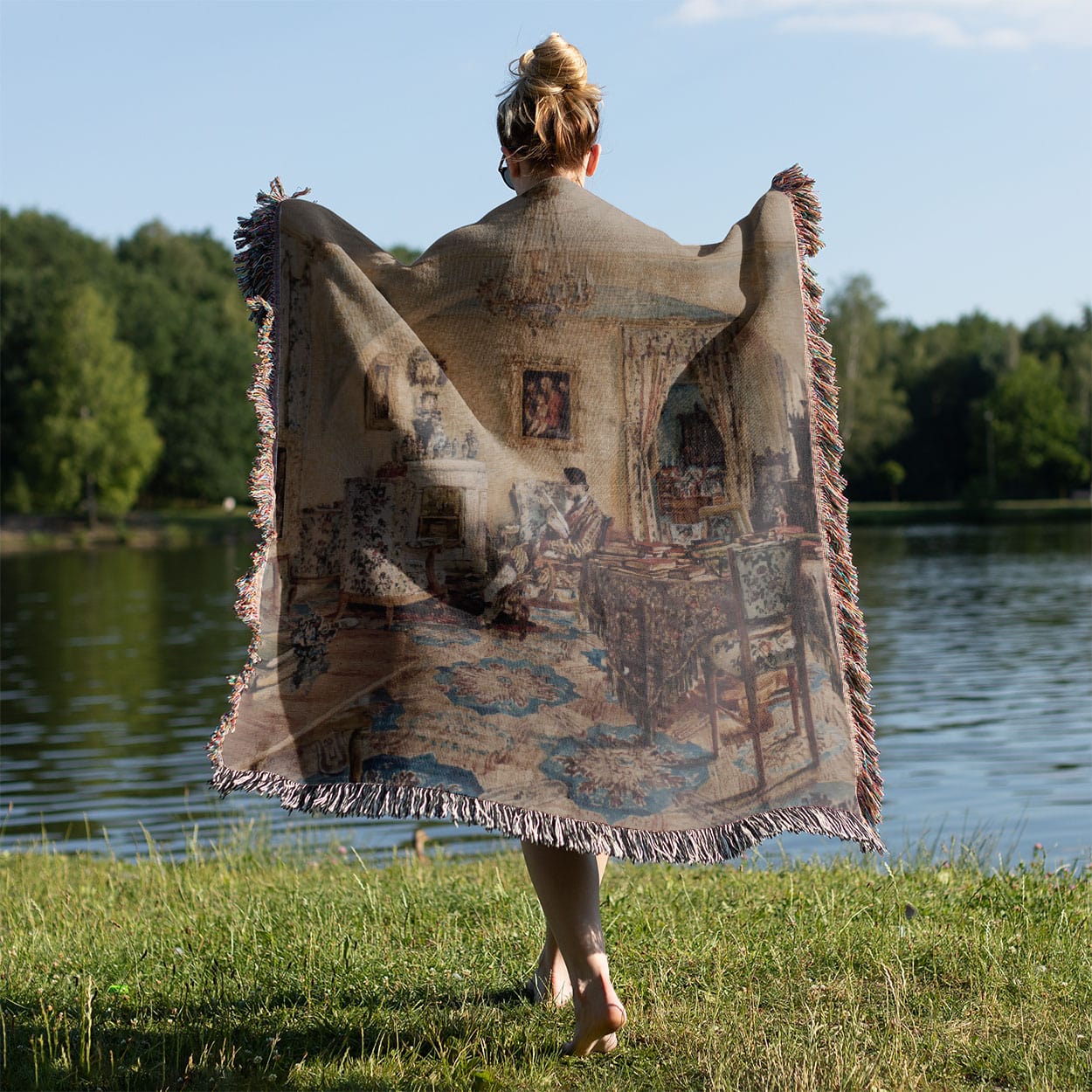 Light Academia Interior Woven Throw Blanket Held on a Woman's Back Outside