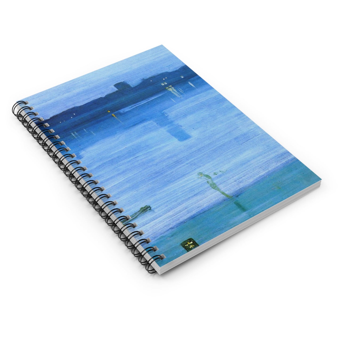 Light Blue Abstract Spiral Notebook Laying Flat on White Surface
