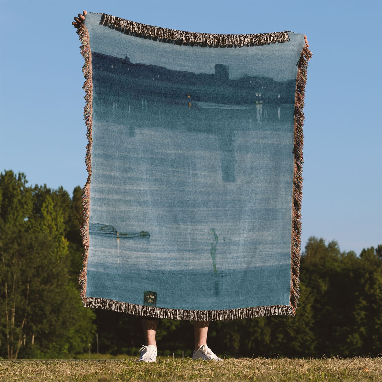 Light Blue Abstract Woven Blanket Held on a Woman's Back Outside