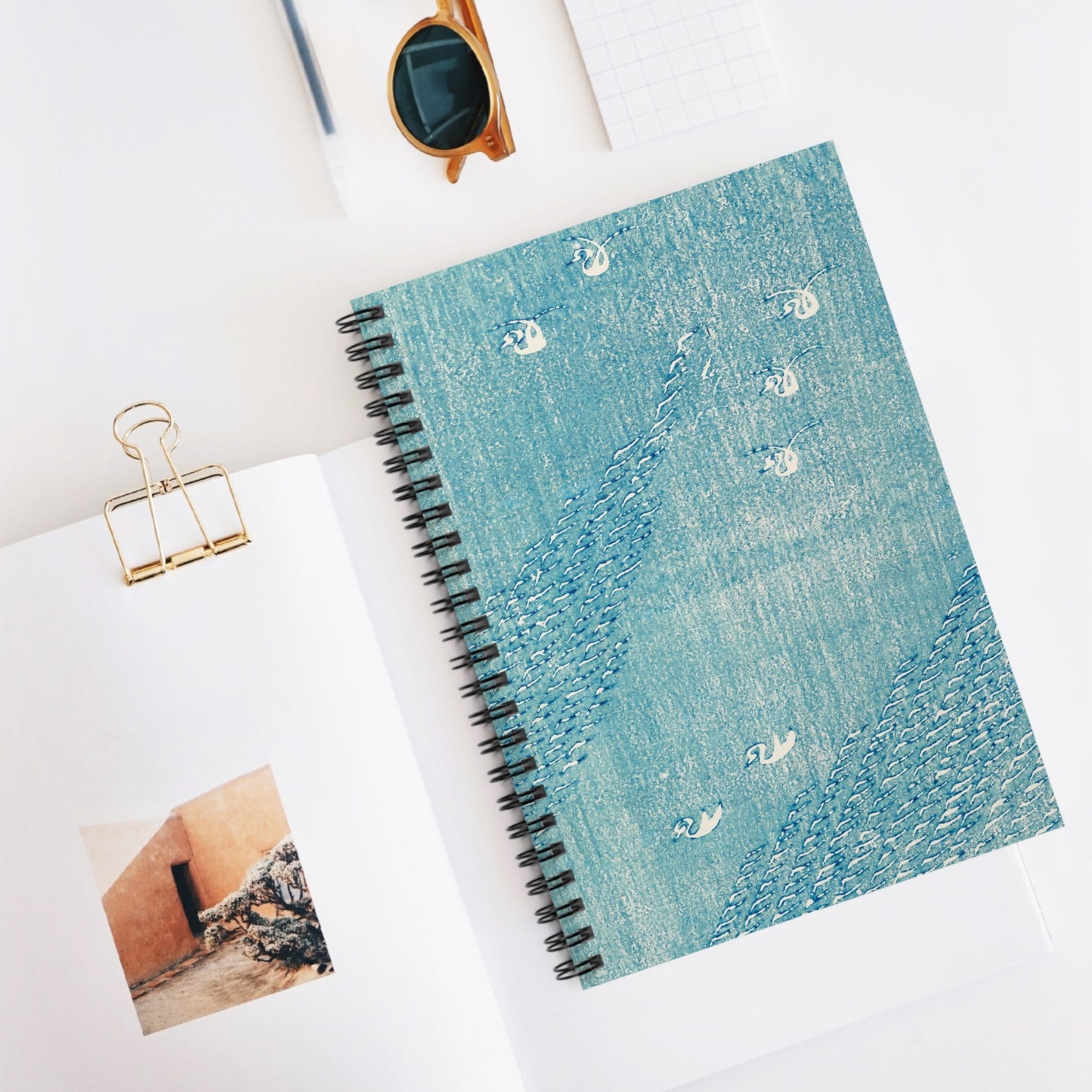 Light Blue Minimalist Spiral Notebook Displayed on Desk