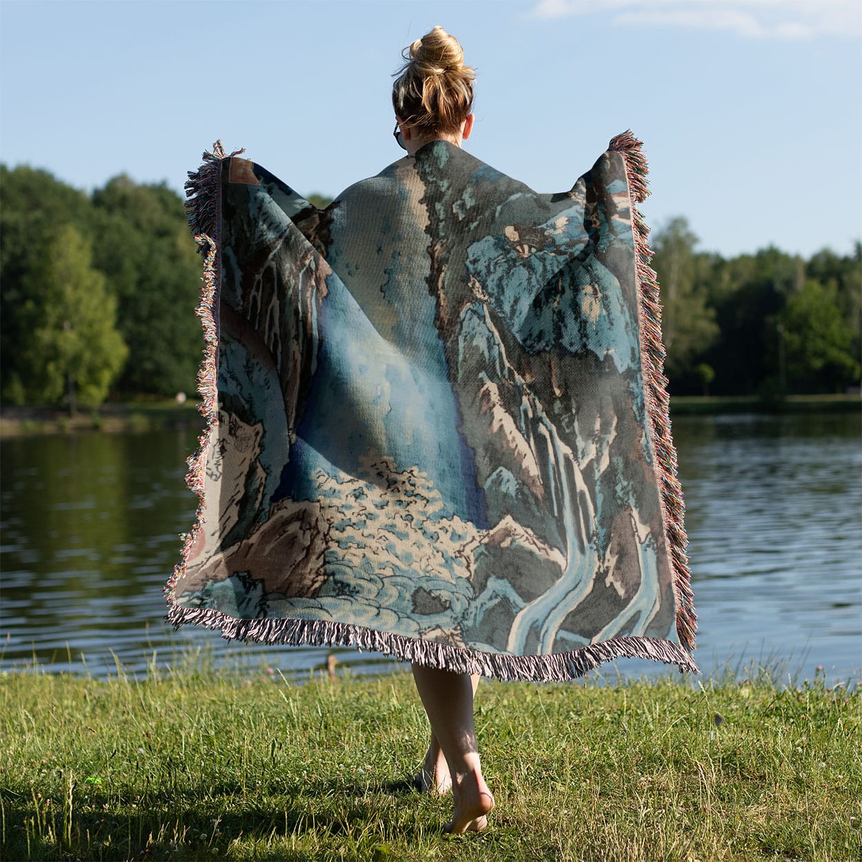 Light Blue Nature Woven Blanket Held Up Outside