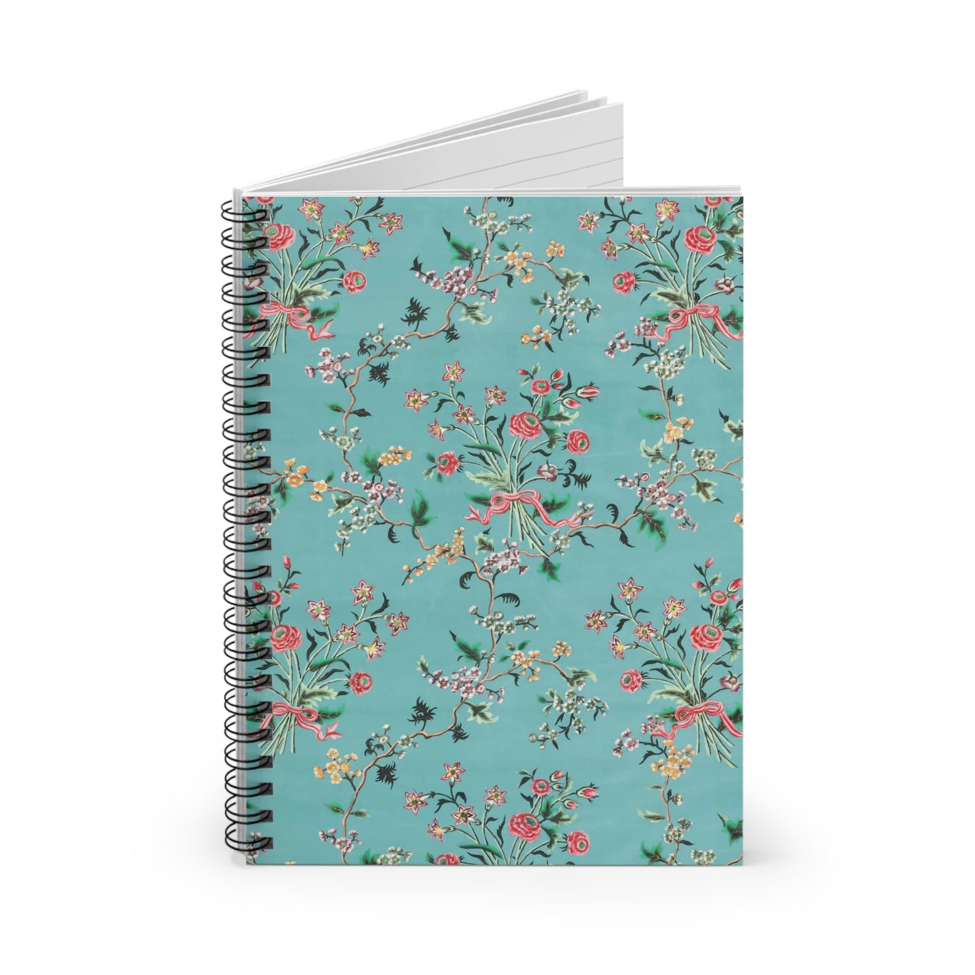 Light Floral Spiral Notebook Standing up on White Desk