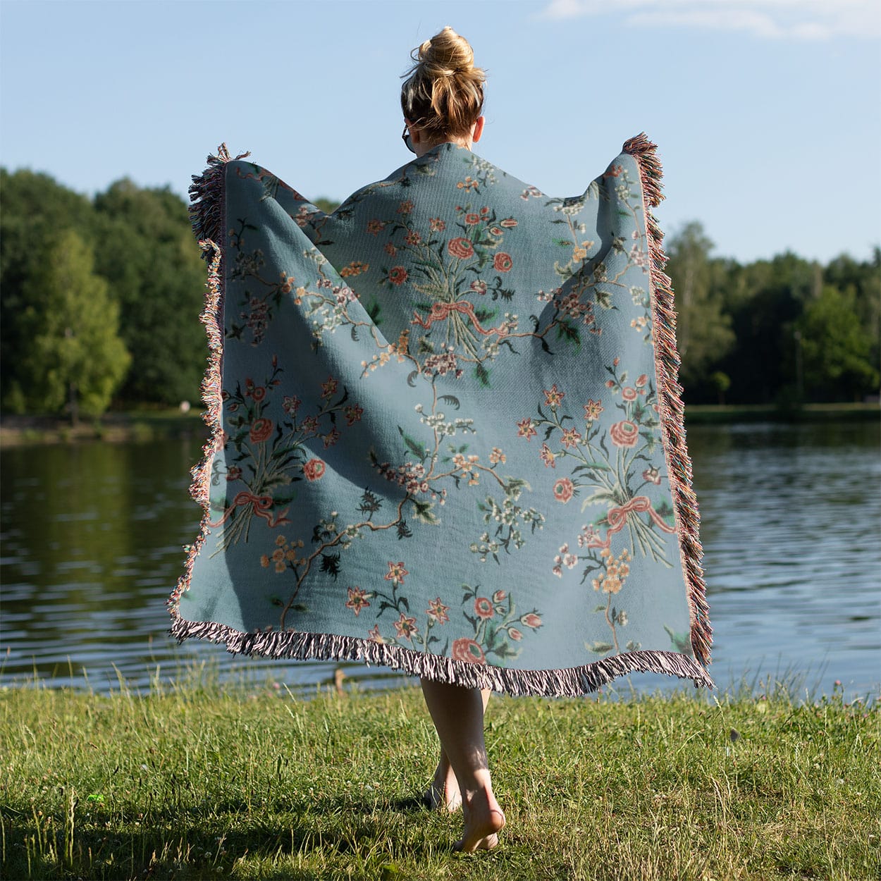 Light Floral Woven Blanket Held Up Outside