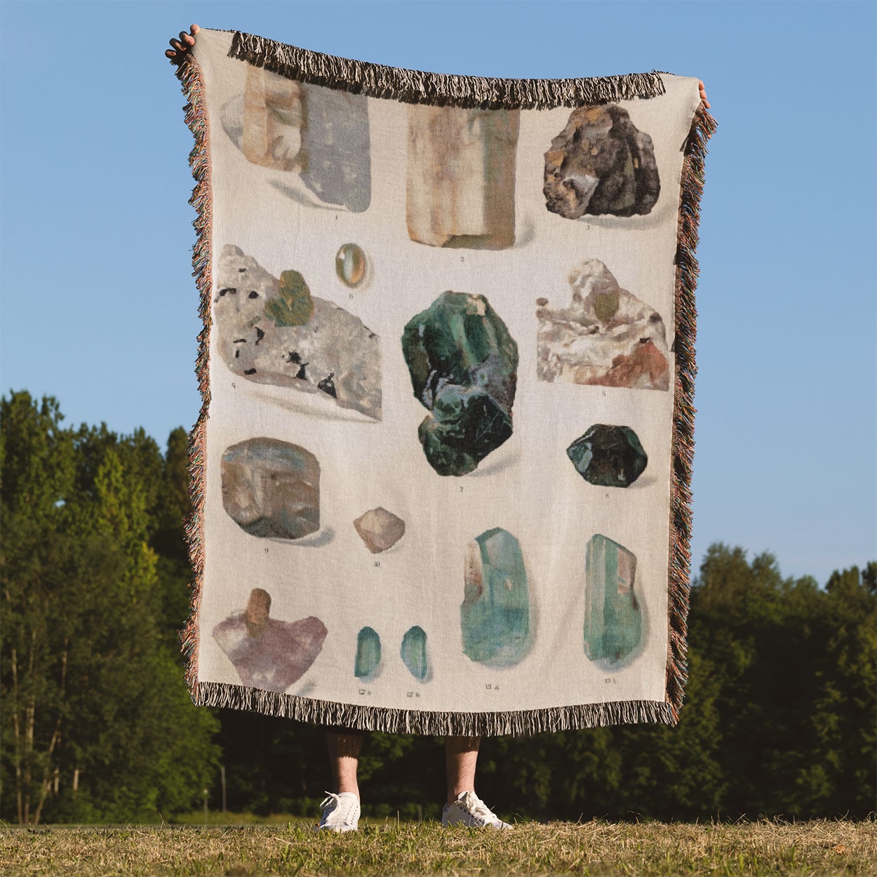 Light Green Gemstone Woven Blanket Held Up Outside