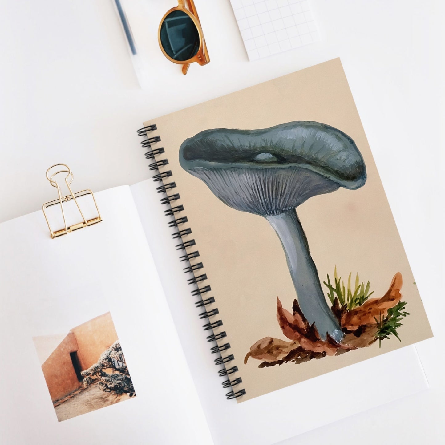 Little Blue Mushrooms Spiral Notebook Displayed on Desk