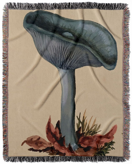 Little Blue Mushrooms woven throw blanket, made from 100% cotton, offering a soft and cozy texture with mushroom art designs for home decor.