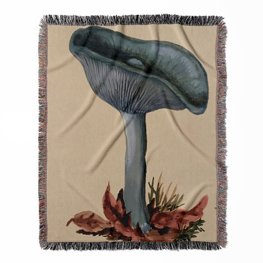 Little Blue Mushrooms woven throw blanket, made from 100% cotton, offering a soft and cozy texture with mushroom art designs for home decor.