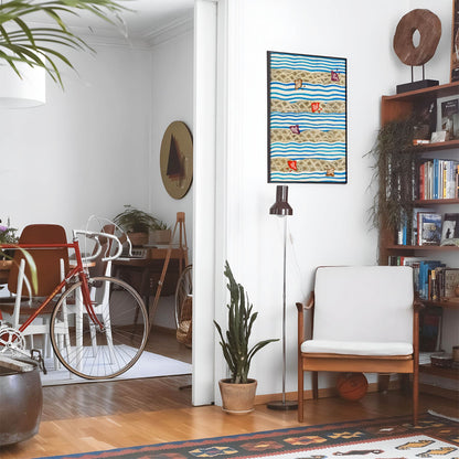 Eclectic living room with a road bike, bookshelf and house plants that features framed artwork of a Blue Wavy Pattern above a chair and lamp