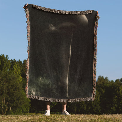 Midnight Forest Woven Blanket Held on a Woman's Back Outside
