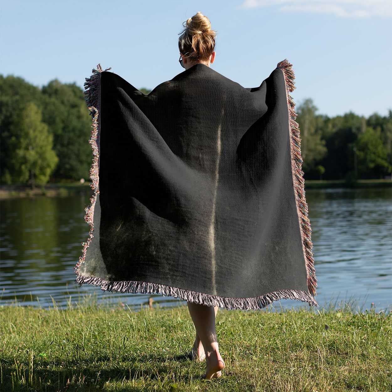 Midnight Forest Woven Blanket Held Up Outside